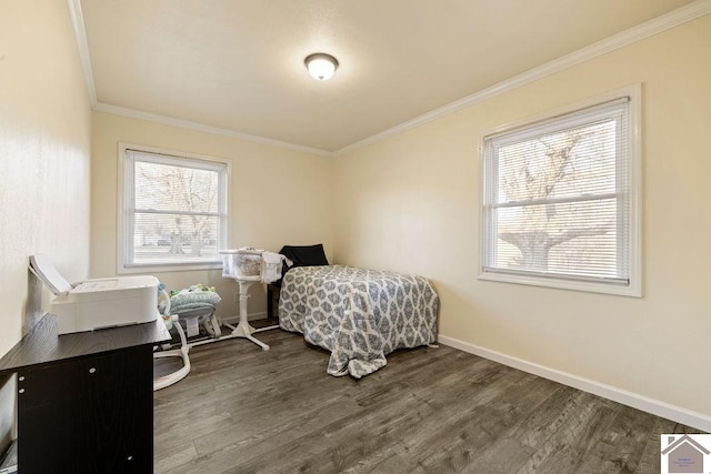 bedroom with multiple windows, crown molding, and wood finished floors