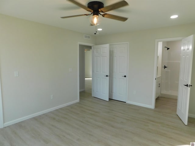 unfurnished bedroom with visible vents, recessed lighting, connected bathroom, light wood-style floors, and baseboards