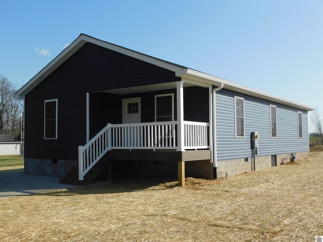 view of front of home with a porch and crawl space