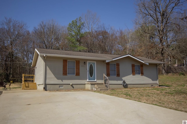 view of front of home featuring roof with shingles and crawl space