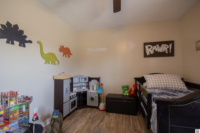 bedroom featuring a ceiling fan and wood finished floors