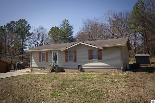 ranch-style home with a front yard, central AC unit, an outbuilding, and crawl space