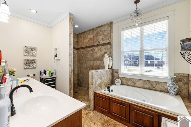 bathroom with vanity, ornamental molding, a walk in shower, a garden tub, and tile patterned floors