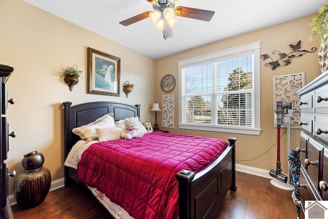 bedroom with ceiling fan, baseboards, and dark wood finished floors