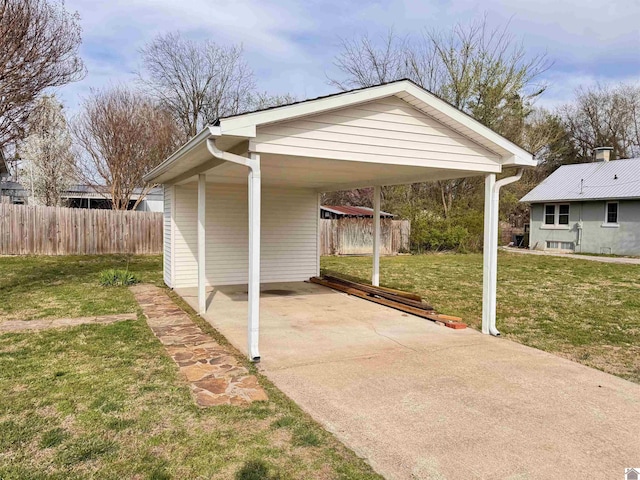 exterior space featuring a carport, fence, and driveway