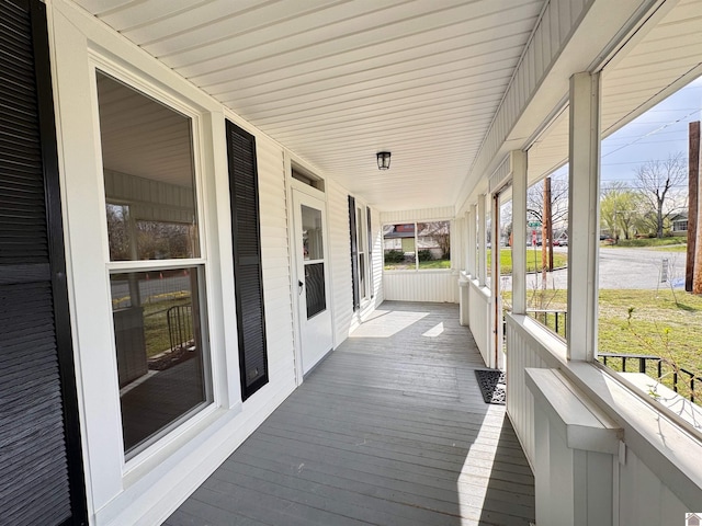 wooden deck featuring covered porch
