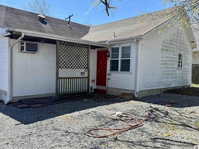 504 Pine St, Murray, KY 42071 - exterior space with a shingled roof and a wall mounted air conditioner