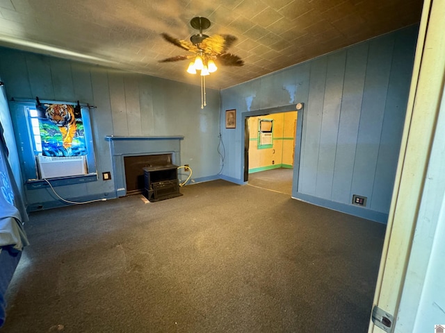 504 Pine St, Murray, KY 42071 - carpeted living area with baseboards, ceiling fan, cooling unit, and a wood stove