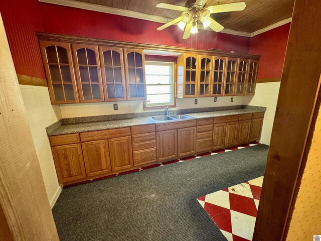 504 Pine St, Murray, KY 42071 - kitchen with crown molding, a sink, a ceiling fan, glass insert cabinets, and brown cabinetry