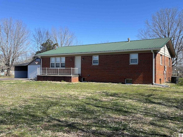 1201 US Highway 68e, Benton, KY 42025 - ranch-style house featuring central AC, metal roof, a front lawn, and brick siding