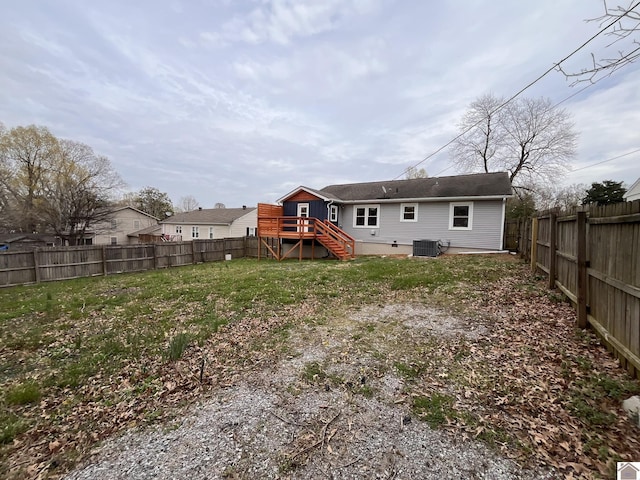 back of house with stairs, central air condition unit, a wooden deck, a fenced backyard, and a yard