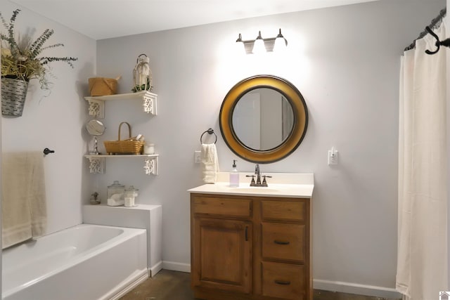 full bathroom featuring baseboards, a garden tub, and vanity
