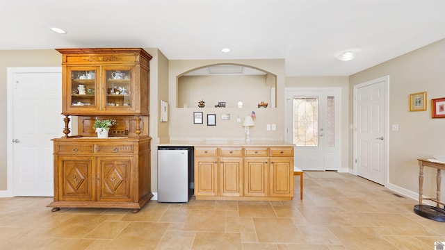 bar with fridge, baseboards, and recessed lighting