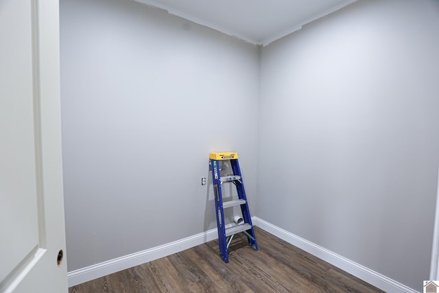 interior space featuring dark wood finished floors and baseboards