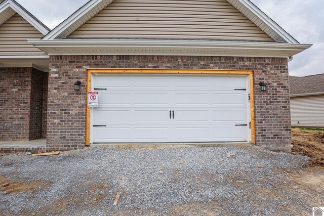 garage featuring driveway