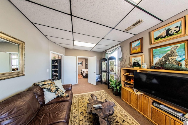 802 Jefferson St, Paducah, KY 42001 - living room with visible vents, a paneled ceiling, and carpet flooring