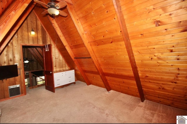 additional living space with vaulted ceiling with beams, carpet flooring, a ceiling fan, wood walls, and wooden ceiling
