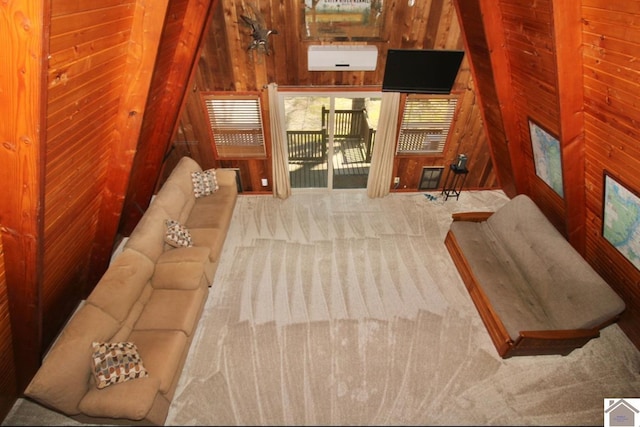 carpeted bedroom featuring wood walls