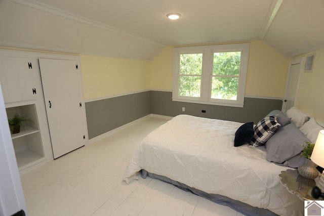 bedroom featuring visible vents, baseboards, and lofted ceiling