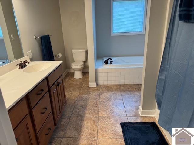 198 Smith Ln, Mayfield, KY 42066 - full bath with a bath, baseboards, toilet, vanity, and tile patterned flooring