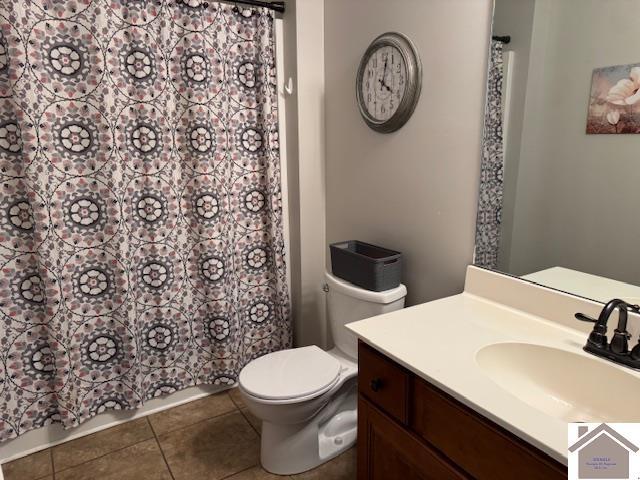 198 Smith Ln, Mayfield, KY 42066 - bathroom featuring toilet, tile patterned floors, curtained shower, and vanity