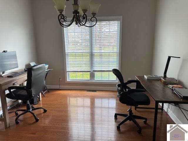 198 Smith Ln, Mayfield, KY 42066 - office featuring wood finished floors, an inviting chandelier, baseboards, and visible vents