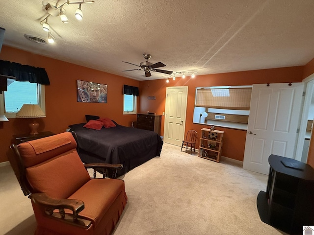 6060 State Route 94 W, Murray, KY 42071 - bedroom with rail lighting, carpet flooring, visible vents, and a textured ceiling