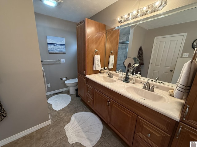 6060 State Route 94 W, Murray, KY 42071 - bathroom featuring tile patterned flooring, baseboards, a sink, and toilet