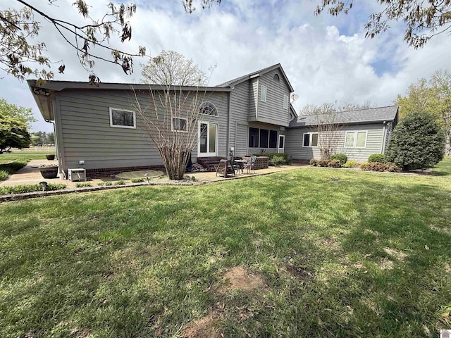 6060 State Route 94 W, Murray, KY 42071 - back of property featuring a patio area and a lawn