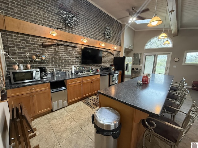 6060 State Route 94 W, Murray, KY 42071 - kitchen featuring a kitchen breakfast bar, light tile patterned floors, brown cabinetry, appliances with stainless steel finishes, and pendant lighting