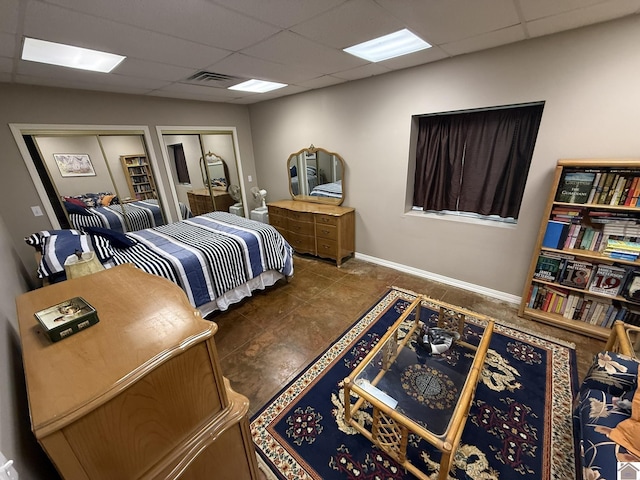 6060 State Route 94 W, Murray, KY 42071 - tiled bedroom featuring multiple closets, visible vents, baseboards, and a paneled ceiling