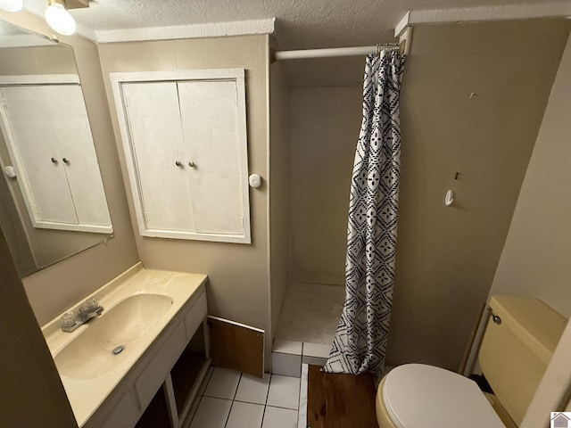 6060 State Route 94 W, Murray, KY 42071 - bathroom with a textured ceiling, vanity, toilet, curtained shower, and tile patterned floors