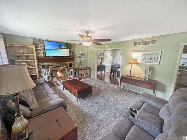 201 Blue River Rd, Cadiz, KY 42211 - carpeted living area featuring visible vents, a ceiling fan, and a brick fireplace