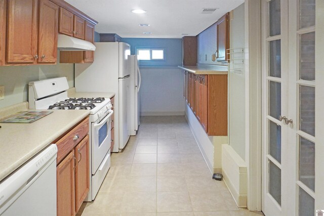 201 Blue River Rd, Cadiz, KY 42211 - kitchen featuring white appliances, brown cabinets, under cabinet range hood, light tile patterned flooring, and french doors