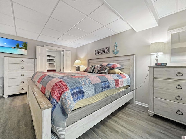 201 Blue River Rd, Cadiz, KY 42211 - bedroom with a paneled ceiling, baseboards, and wood finished floors