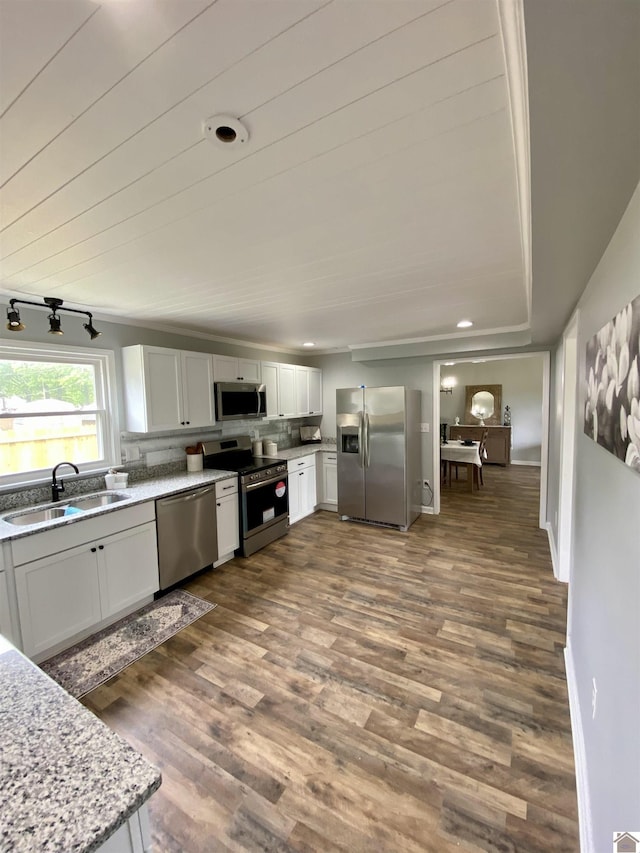 115 Marsha Dr, Ledbetter, KY 42058 - kitchen featuring light stone counters, a sink, stainless steel appliances, white cabinetry, and dark wood-type flooring