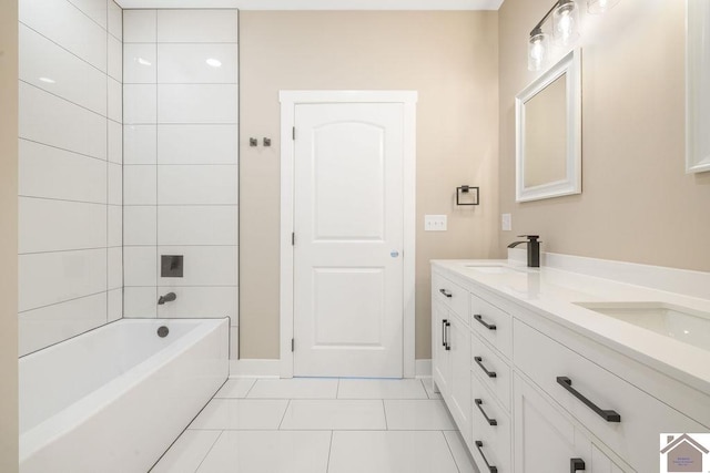 102 Ironwood Dr, Murray, KY 42071 - bathroom with double vanity, tile patterned flooring, baseboards, and a sink