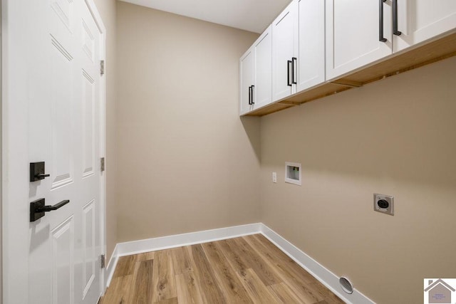 102 Ironwood Dr, Murray, KY 42071 - washroom with hookup for an electric dryer, cabinet space, light wood-type flooring, and baseboards