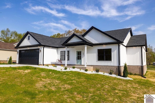 102 Ironwood Dr, Murray, KY 42071 - modern inspired farmhouse featuring an attached garage, a front yard, concrete driveway, and roof with shingles
