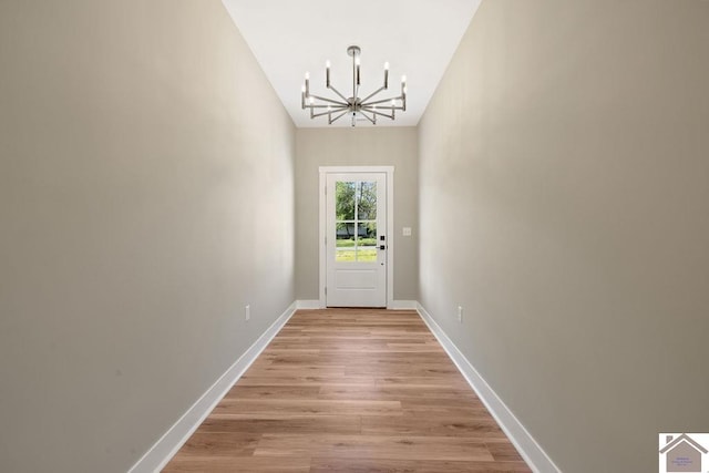 102 Ironwood Dr, Murray, KY 42071 - doorway with baseboards, a notable chandelier, and light wood-type flooring