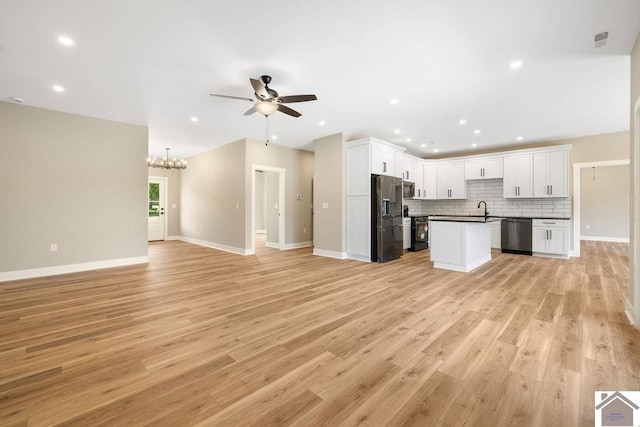 102 Ironwood Dr, Murray, KY 42071 - kitchen featuring stainless steel appliances, a sink, open floor plan, visible vents, and ceiling fan with notable chandelier