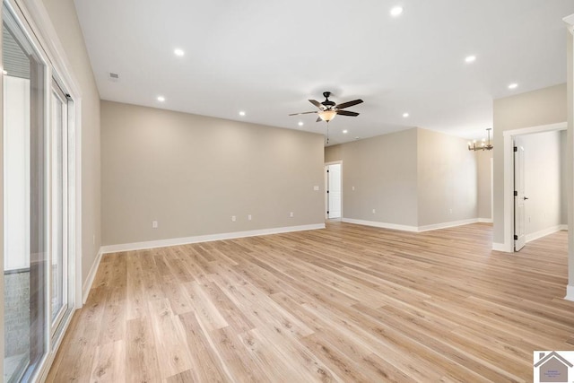 102 Ironwood Dr, Murray, KY 42071 - unfurnished room with baseboards, recessed lighting, light wood-style flooring, and ceiling fan with notable chandelier