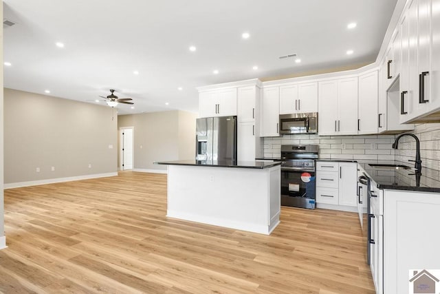 102 Ironwood Dr, Murray, KY 42071 - kitchen featuring decorative backsplash, a ceiling fan, stainless steel appliances, and a sink