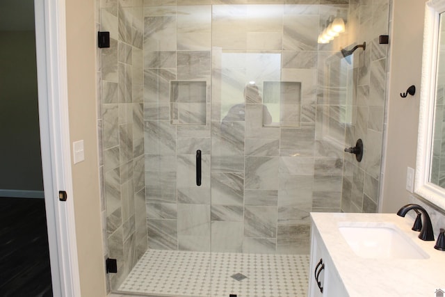 full bathroom featuring vanity and a stall shower