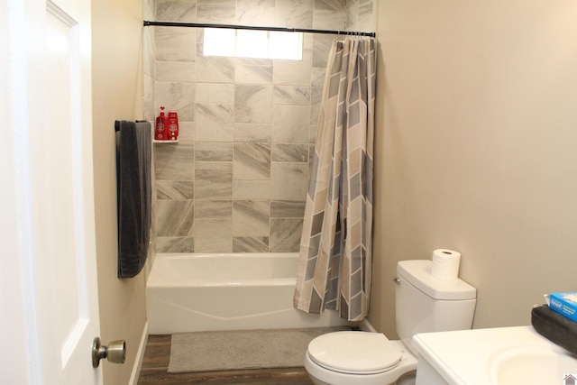 full bathroom featuring shower / bath combination with curtain, toilet, vanity, and wood finished floors