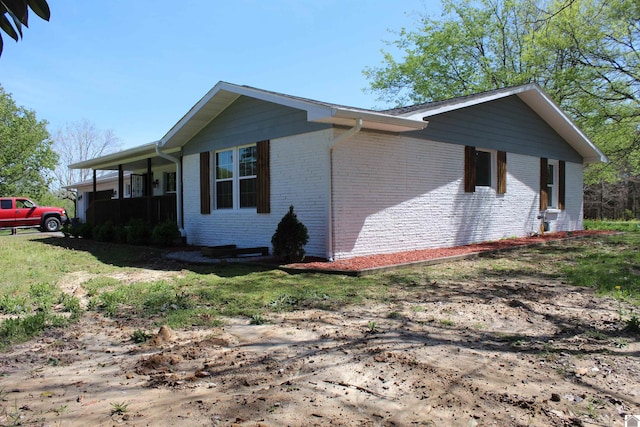 view of property exterior featuring brick siding