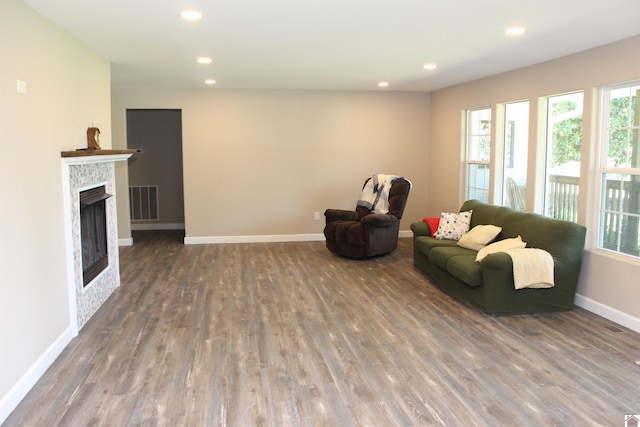 sitting room featuring wood finished floors, visible vents, and a wealth of natural light