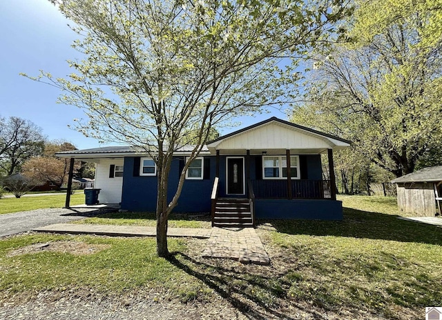 view of front of home with covered porch and a front yard