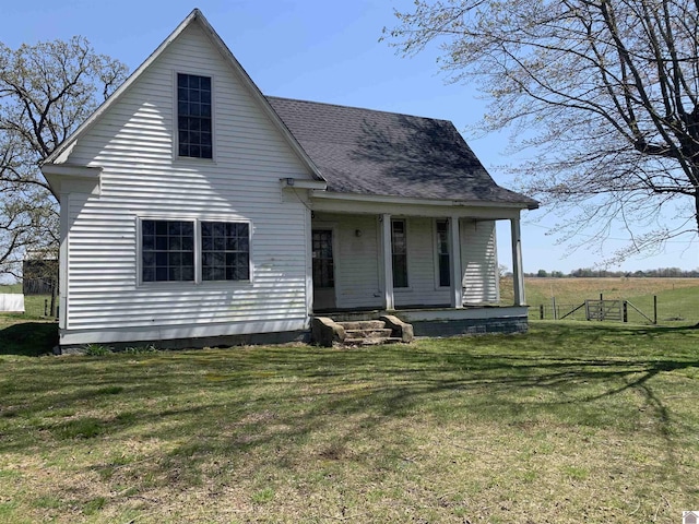 1368 Pritchard Rd, Wingo, KY 42088 - bungalow-style house featuring a porch, a shingled roof, a front lawn, and fence