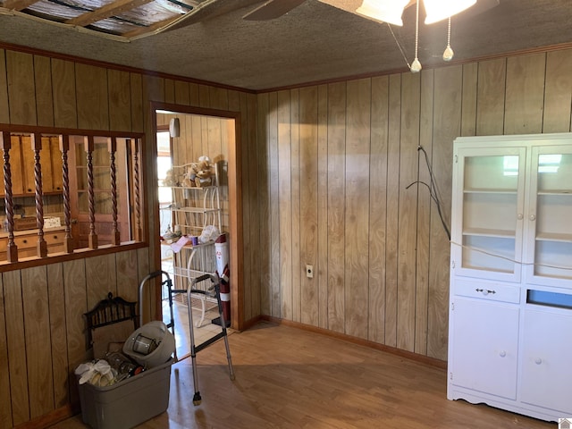 1368 Pritchard Rd, Wingo, KY 42088 - interior space with a ceiling fan, wood finished floors, baseboards, wood walls, and ornamental molding